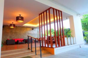 a staircase leading to a living room with a table at The Pride in Sathani Wat Suwan +126 photos