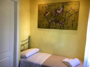 Postel nebo postele na pokoji v ubytování B&B Harmonia