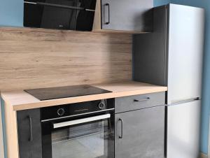 Kuchyň nebo kuchyňský kout v ubytování ECUME Appartement climatisé cosy 2 chambres pour 4 personnes au Barcarès