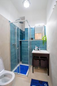 a bathroom with a shower and a sink and a toilet at villa del mare in Nettuno +20 photos