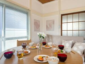 a dining room table with plates of food on it at #39 Ukimafunado in Tokyo