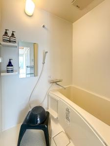 a bathroom with a bath tub and a mirror at -浮間舟渡 菖Iris-Entire 2nd floor in Tokyo +27 photos