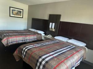 Postel nebo postele na pokoji v ubytování Scottish Inns Augusta + 42 fotografií