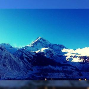 a mountain range with snow on top of it at Panorama Kazbegi in Stepantsminda