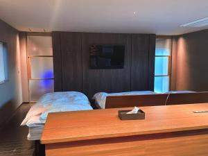 Ένα ή περισσότερα κρεβάτια σε δωμάτιο στο SENJA Dewata