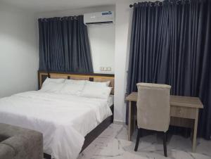 Ένα ή περισσότερα κρεβάτια σε δωμάτιο στο Standard Management services Apartment