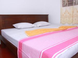 Postel nebo postele na pokoji v ubytování Dilan Guest
