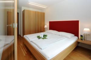 Postel nebo postele na pokoji v ubytování Apartments Susanne