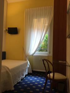Ένα ή περισσότερα κρεβάτια σε δωμάτιο στο My Hotel Milano
