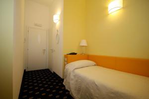 Ένα ή περισσότερα κρεβάτια σε δωμάτιο στο My Hotel Milano