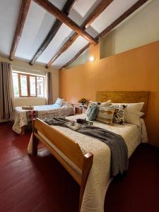 Postel nebo postele na pokoji v ubytování Casa Paqocha Garden - Ollantaytambo - Hot Water - Wifi - Cocina Compartida