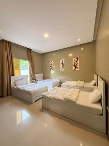 Postel nebo postele na pokoji v ubytování Salalah Social Club