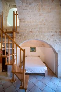 Ένα ή περισσότερα κρεβάτια σε δωμάτιο στο Dimora Conte, Alberobello