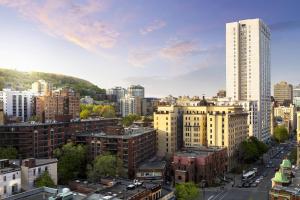 a view of a city with tall buildings at SENS Høtel in Montreal