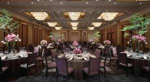 a banquet hall with tables and chairs and flowers at Nippondaira Hotel in Shizuoka