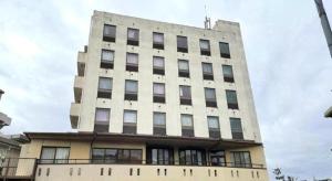 a tall white building with windows on top of it at Inuyamakan in Inuyama +43 photos