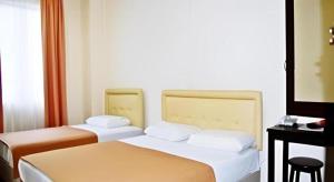 Postel nebo postele na pokoji v ubytování Rafayeh Hotel