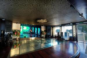 a room with a dance floor in a building at Starlight Cruise Ha Long in Ha Long
