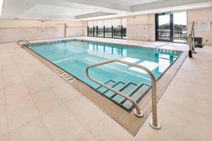 a large swimming pool in a building at Comfort Inn & Suites in Bradford