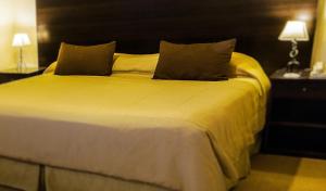 Cama ou camas em um quarto em Hotel Michelangelo