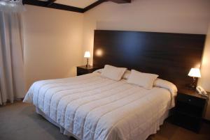 Cama ou camas em um quarto em Hotel Michelangelo