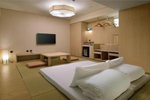TV a/nebo společenská místnost v ubytování Chihpen Century Hotel