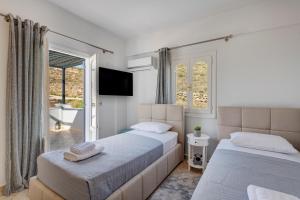 Postel nebo postele na pokoji v ubytování Elysia House