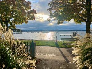 a view of a harbor with boats in the water at Pittino Gartensuite 03 in zweiter Seereihe Ammersee in Herrsching am Ammersee +6 photos