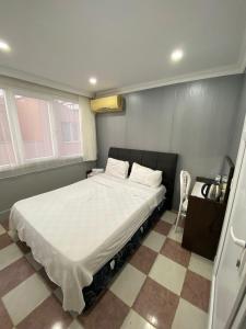 Postel nebo postele na pokoji v ubytování Ezel Group Hotel + 23 fotografií