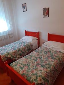 Postel nebo postele na pokoji v ubytování Locanda da Lucia