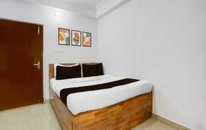 Postel nebo postele na pokoji v ubytování Hotel O Shalimar Central Railway Junction Kolkata
