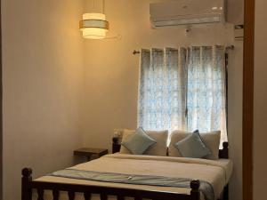 Postel nebo postele na pokoji v ubytování De beachside Villa