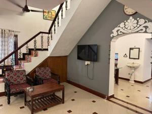 TV a/nebo společenská místnost v ubytování De beachside Villa