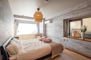 Postel nebo postele na pokoji v ubytování Spacious Living and Garden 10 min walk from Shizuoka station