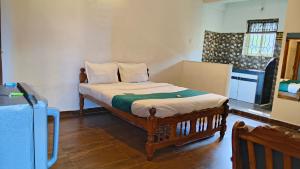 Kuchyň nebo kuchyňský kout v ubytování Candolim Beach Inn By RIH