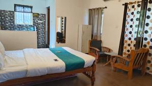 Postel nebo postele na pokoji v ubytování Candolim Beach Inn By RIH