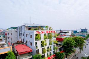 a building with a sign on the side of it at Thu Ha Hotel in Uông Bí