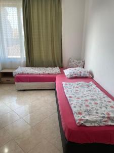 two beds sitting next to each other in a room at Casa De Zambini in Plovdiv