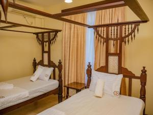 Ένα ή περισσότερα κρεβάτια σε δωμάτιο στο AfroHaki Homes +14 φωτογραφίες