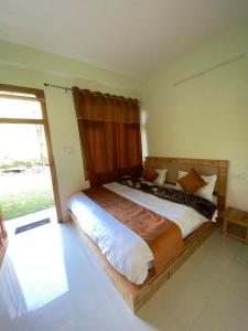 Ένα ή περισσότερα κρεβάτια σε δωμάτιο στο The Spiritual Cafe +7 φωτογραφίες