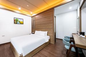 Ένα ή περισσότερα κρεβάτια σε δωμάτιο στο A25 Hotel - 21 Nghia Tan +6 φωτογραφίες