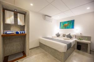 Ένα ή περισσότερα κρεβάτια σε δωμάτιο στο Royal Sea Wind