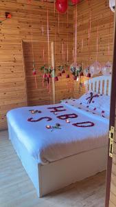 a bedroom with a bed with decorations on it at اكواخ الغصن الريفيه in Jeddah