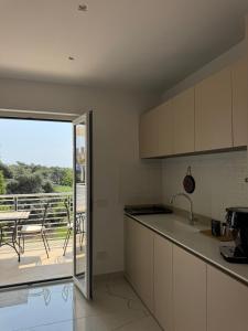 Kuchyň nebo kuchyňský kout v ubytování Olmata B&b