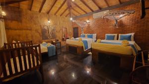 a bedroom with two beds in a room at Ceylon wilpattu safaris & lodging in Wilpattu