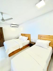 Ένα ή περισσότερα κρεβάτια σε δωμάτιο στο Jazeeraa beach stay