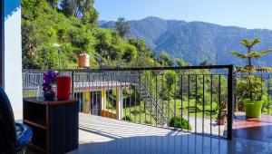a balcony with a view of a mountain at Summer Guest House in Chauntrā +31 photos