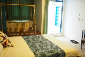Krevet ili kreveti u jedinici u okviru objekta Shengtuolini B&B