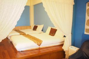Krevet ili kreveti u jedinici u okviru objekta Shengtuolini B&B