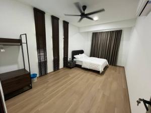 a bedroom with a bed and a ceiling fan at CasaD'Tamarind Homestay with Private Pool in Alor Setar +17 photos